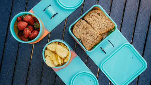 Image of Silipint Go Go Bowls and Go Go Box full of strawberries, chips and a sandwich